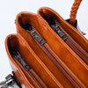 Pia | "Elegant leather handbag with braided handle".-Elly Rose