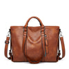 Sign | "Large leather shoulder bag".-Elly Rose